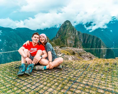A couple of tourists in the citadel of Machu Picchu