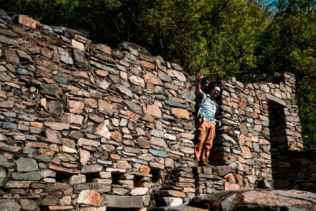 Choquequirao: The Real History Of The “Sister City Of Machu Picchu” The World Still Doesn’t Know 1 Visitor at Choquequirao, looking out of wall