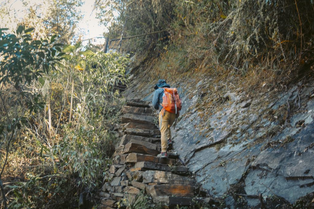 Tourist hiking up steps on the Choquequirao Trek
